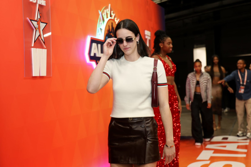 PHOENIX, AZ - JULY 20: Caitlin Clark #22 of Team WNBA walks from the orange carpet before the 2024 WNBA All Star Game at Footprint Center on July 20, 2024 in Phoenix, Arizona. NOTE TO USER: User expressly acknowledges and agrees that, by downloading and/or using this Photograph, user is consenting to the terms and conditions of the Getty Images License Agreement. Mandatory Copyright Notice: Copyright 2024 NBAE (Photo by Dylan Goodman/NBAE via Getty Images)