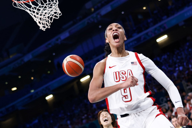 USA's #09 A'ja Wilson celebrates after scoring in the women's preliminary round group C basketball match between USA and Japan during the Paris 2024 Olympic Games at the Pierre-Mauroy stadium in Villeneuve-d'Ascq, northern France, on July 29, 2024. (Photo by Sameer Al-Doumy / AFP) (Photo by SAMEER AL-DOUMY/AFP via Getty Images)