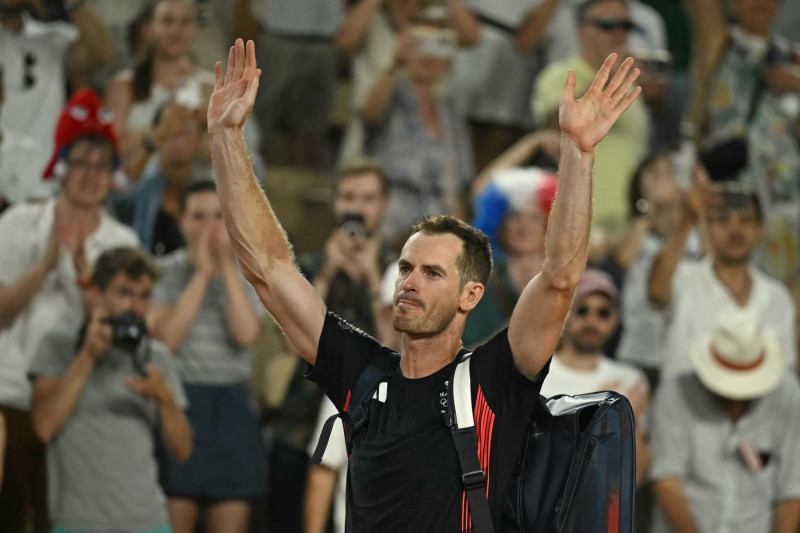 Britain's Andy Murray waves goodbye after playing with Britain's Daniel Evans  against US' Taylor Fritz and US' Tommy Paul in their men's doubles quarter-final tennis match on Court Suzanne-Lenglen at the Roland-Garros Stadium during the Paris 2024 Olympic Games, in Paris on August 1, 2024. (Photo by CARL DE SOUZA / AFP) (Photo by CARL DE SOUZA/AFP via Getty Images)