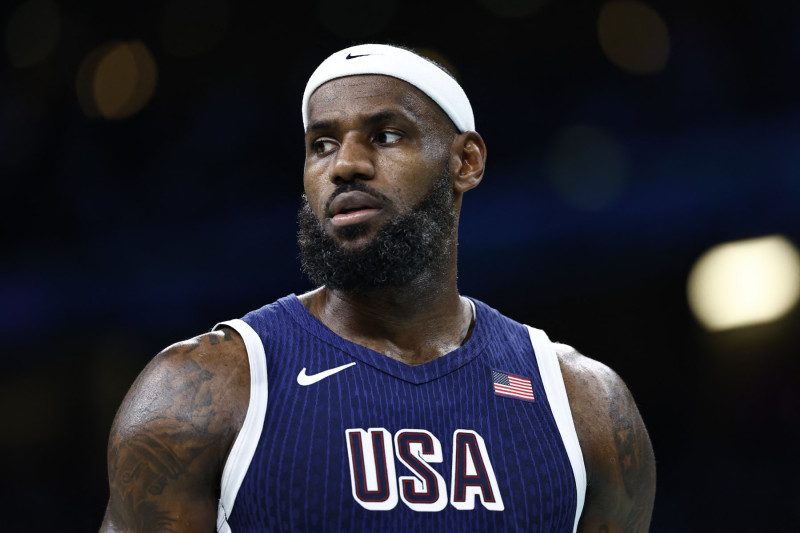 USA's #06 LeBron James reacts in the men's preliminary round group C basketball match between Puerto Rico and USA during the Paris 2024 Olympic Games at the Pierre-Mauroy stadium in Villeneuve-d'Ascq, northern France, on August 3, 2024. (Photo by Sameer Al-Doumy / AFP) (Photo by SAMEER AL-DOUMY/AFP via Getty Images)