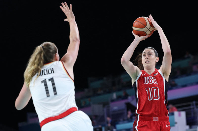 USA's #10 Breanna Stewart takes a shot in the women's preliminary round group C basketball match between Germany and USA during the Paris 2024 Olympic Games at the Pierre-Mauroy stadium in Villeneuve-d'Ascq, northern France, on August 4, 2024. (Photo by Thomas COEX / AFP) (Photo by THOMAS COEX/AFP via Getty Images)