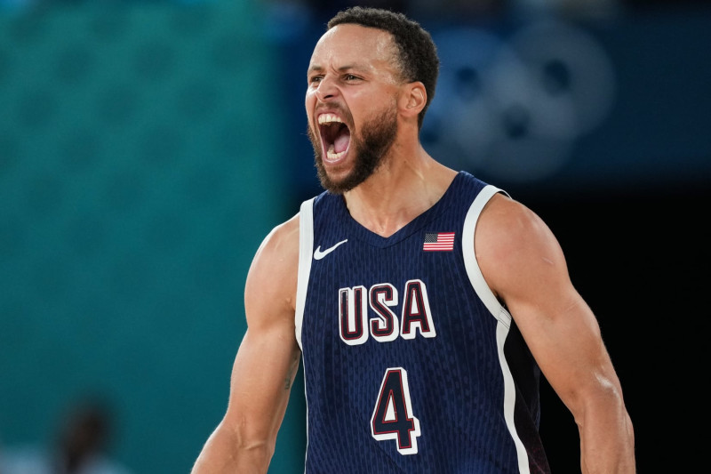 PARIS, FRANCE - AUGUST 10: Stephen Curry (4) of Team USA reacts during Men's Gold Medal game between Team France and Team United States on day fifteen of the Olympic Games Paris 2024 at Bercy Arena on August 10, 2024 in Paris, France. (Photo by Mustafa Ciftci/Anadolu via Getty Images)