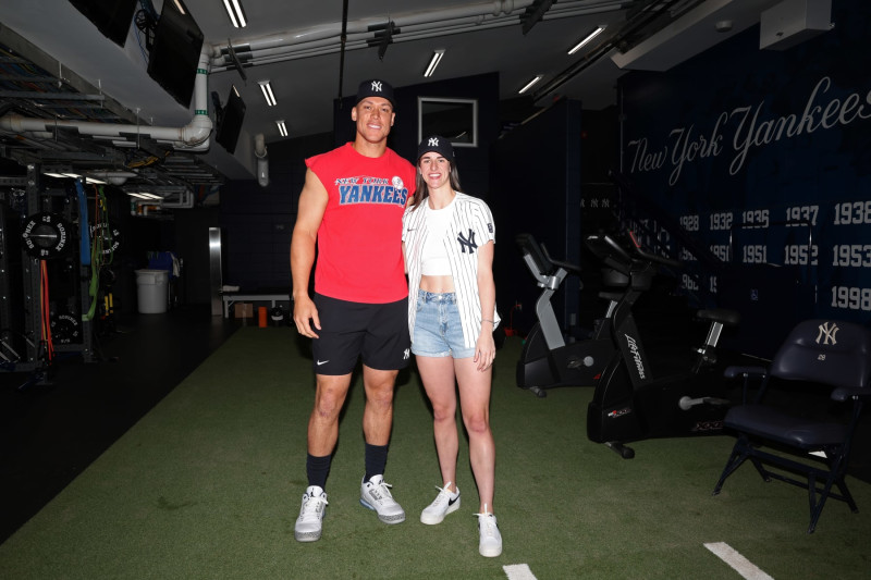 NEW YORK, NY - AUGUST 10: Aaron Judge #99 of the New York Yankees and Caitlin Clark of the Indiana Fever pose for a photo before the game between the Texas Rangers and the New York Yankees at Yankee Stadium on August 10, 2024, in New York, New York. (Photo by New York Yankees/Getty Images)