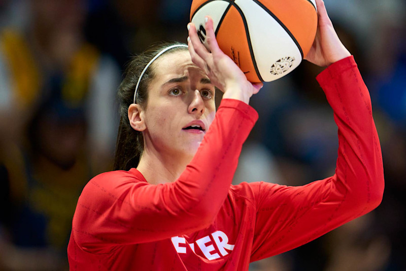 ARLINGTON, TEXAS - JULY 17: Caitlin Clark #22 of the Indiana Fever warms up before tipoff against the Dallas Wings at the College Park Center on July 17, 2024 in Arlington, Texas. NOTE TO USER: User expressly acknowledges and agrees that, by downloading and or using this photograph, User is consenting to the terms and conditions of the Getty Images License Agreement.  (Photo by Cooper Neill/Getty Images)