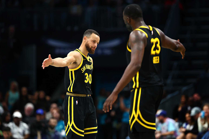 CHARLOTTE, NORTH CAROLINA - MARCH 29: Stephen Curry #30 and Draymond Green #23 of the Golden State Warriors react during the second half of the game against the Charlotte Hornets at Spectrum Center on March 29, 2024 in Charlotte, North Carolina. NOTE TO USER: User expressly acknowledges and agrees that, by downloading and or using this photograph, User is consenting to the terms and conditions of the Getty Images License Agreement. (Photo by Jared C. Tilton/Getty Images)