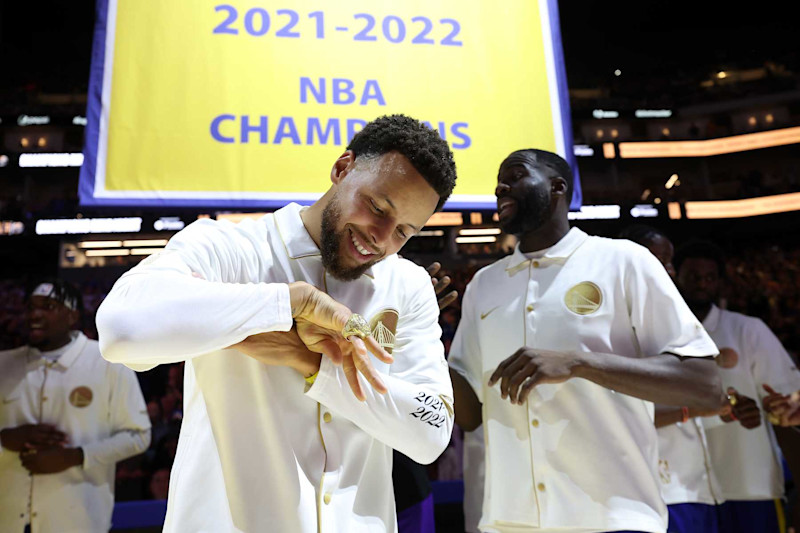 SAN FRANCISCO, CALIFORNIA - OCTOBER 18:  Stephen Curry #30 of the Golden State Warriors inspects his championship ring during a ceremony prior to the game against the Los Angeles Lakers at Chase Center on October 18, 2022 in San Francisco, California. NOTE TO USER: User expressly acknowledges and agrees that, by downloading and or using this photograph, User is consenting to the terms and conditions of the Getty Images License Agreement. (Photo by Ezra Shaw/Getty Images)