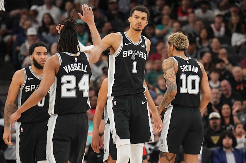 SAN ANTONIO, TX - MARCH 12: Devin Vassell #24 and Victor Wembanyama #1 of the San Antonio Spurs high five during the game against the Houston Rockets on March 12, 2024 at the Frost Bank Center in San Antonio, Texas. NOTE TO USER: User expressly acknowledges and agrees that, by downloading and or using this photograph, user is consenting to the terms and conditions of the Getty Images License Agreement. Mandatory Copyright Notice: Copyright 2024 NBAE (Photos by Jesse D. Garrabrant/NBAE via Getty Images)