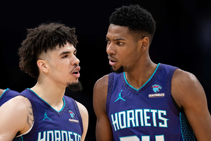 CHARLOTTE, NORTH CAROLINA - JANUARY 19: (L-R) LaMelo Ball #1 of the Charlotte Hornets reacts with Brandon Miller #24  in the first quarter during their game against the San Antonio Spurs at Spectrum Center on January 19, 2024 in Charlotte, North Carolina. NOTE TO USER: User expressly acknowledges and agrees that, by downloading and or using this photograph, User is consenting to the terms and conditions of the Getty Images License Agreement. (Photo by Jacob Kupferman/Getty Images)