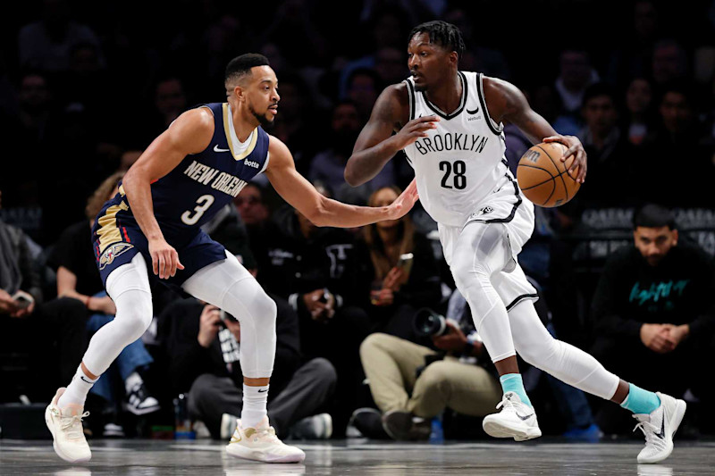 NEW YORK, NEW YORK - MARCH 19: Dorian Finney-Smith #28 of the Brooklyn Nets dribbles against CJ McCollum #3 of the New Orleans Pelicans during the first half at Barclays Center on March 19, 2024 in the Brooklyn borough of New York City. NOTE TO USER: User expressly acknowledges and agrees that, by downloading and/or using this Photograph, user is consenting to the terms and conditions of the Getty Images License Agreement. (Photo by Sarah Stier/Getty Images)