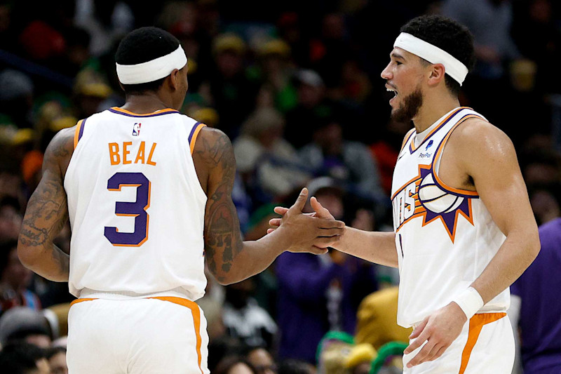 NEW ORLEANS, LOUISIANA - JANUARY 19: Devin Booker #1 of the Phoenix Suns and Bradley Beal #3 of the Phoenix Suns react after scoring against the New Orleans Pelicans during the second quarter of an NBA game at Smoothie King Center on January 19, 2024 in New Orleans, Louisiana. NOTE TO USER: User expressly acknowledges and agrees that, by downloading and or using this photograph, User is consenting to the terms and conditions of the Getty Images License Agreement. (Photo by Sean Gardner/Getty Images)