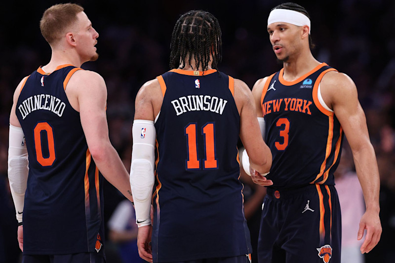 NEW YORK, NEW YORK - MAY 08: Donte DiVincenzo #0, Jalen Brunson #11 and Josh Hart #3 of the New York Knicks celebrate their win against the Indiana Pacers in Game Two of the Eastern Conference Second Round Playoffs at Madison Square Garden on May 08, 2024 in New York City. NOTE TO USER: User expressly acknowledges and agrees that, by downloading and or using this photograph, User is consenting to the terms and conditions of the Getty Images License Agreement. (Photo by Elsa/Getty Images)