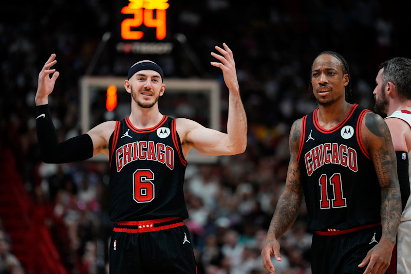 MIAMI, FLORIDA - APRIL 19: Alex Caruso #6 and DeMar DeRozan #11 of the Chicago Bulls look on against the Miami Heat in the fourth quarter during the Play-In Tournament at Kaseya Center on April 19, 2024 in Miami, Florida. NOTE TO USER: User expressly acknowledges and agrees that, by downloading and or using this photograph, User is consenting to the terms and conditions of the Getty Images License Agreement. (Photo by Rich Storry/Getty Images)