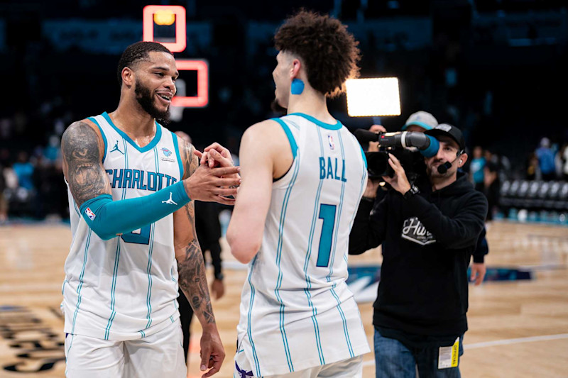 CHARLOTTE, NORTH CAROLINA - NOVEMBER 22: (L-R) Miles Bridges #0 and LaMelo Ball #1 of the Charlotte Hornets celebrate after defeating the Washington Wizards during their game at Spectrum Center on November 22, 2023 in Charlotte, North Carolina. NOTE TO USER: User expressly acknowledges and agrees that, by downloading and or using this photograph, User is consenting to the terms and conditions of the Getty Images License Agreement. (Photo by Jacob Kupferman/Getty Images)