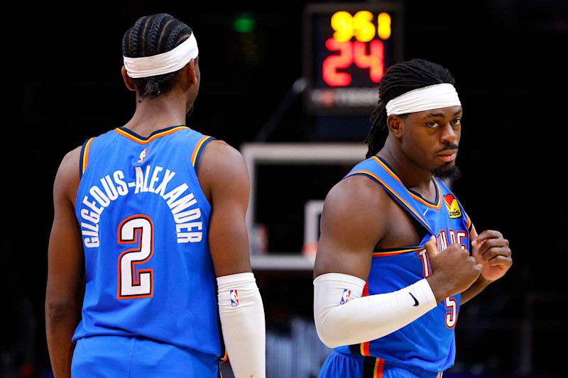 ATLANTA, GEORGIA - JANUARY 3: Luguentz Dort #5 and Shai Gilgeous-Alexander #2 of the Oklahoma City Thunder react in the third quarter against the Atlanta Hawks at State Farm Arena on January 3, 2024 in Atlanta, Georgia. NOTE TO USER: User expressly acknowledges and agrees that, by downloading and or using this photograph, User is consenting to the terms and conditions of the Getty Images License Agreement. (Photo by Todd Kirkland/Getty Images)