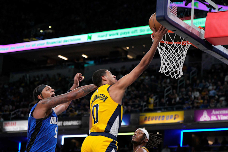 INDIANAPOLIS, INDIANA - NOVEMBER 19: Tyrese Haliburton #0 of the Indiana Pacers shoots against Paolo Banchero #5 of the Orlando Magic at Gainbridge Fieldhouse on November 19, 2023 in Indianapolis, Indiana. NOTE TO USER: User expressly acknowledges and agrees that, by downloading and or using this photograph, User is consenting to the terms and conditions of the Getty Images License Agreement. (Photo by Jeff Dean/Getty Images)