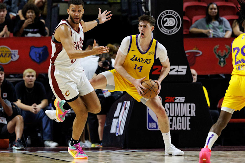 LAS VEGAS, NV - JULY 18, 2024: Los Angeles Lakers center Colin Castleton (14) reacts as he beats Cleveland Cavaliers forward Pete Nance (8) to a defensive rebound  during the NBA 2K25 Summer League  at the Thomas & Mack Center on  July 18, 2024 in Las Vegas, Nevada.(Gina Ferazzi / Los Angeles Times via Getty Images)