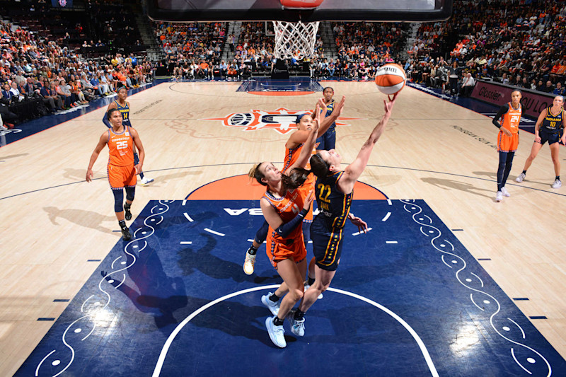 UNCASVILLE, CT - SEPTEMBER 22: Caitlin Clark #22 of the Indiana Fever drives to the basket during the game against the Connecticut Sun during round one game one of the 2024 WNBA Playoffs on September 22, 2024 at the Mohegan Sun Arena in Uncasville, Connecticut. NOTE TO USER: User expressly acknowledges and agrees that, by downloading and or using this photograph, User is consenting to the terms and conditions of the Getty Images License Agreement. Mandatory Copyright Notice: Copyright 2024 NBAE (Photo by Jesse D. Garrabrant/NBAE via Getty Images)