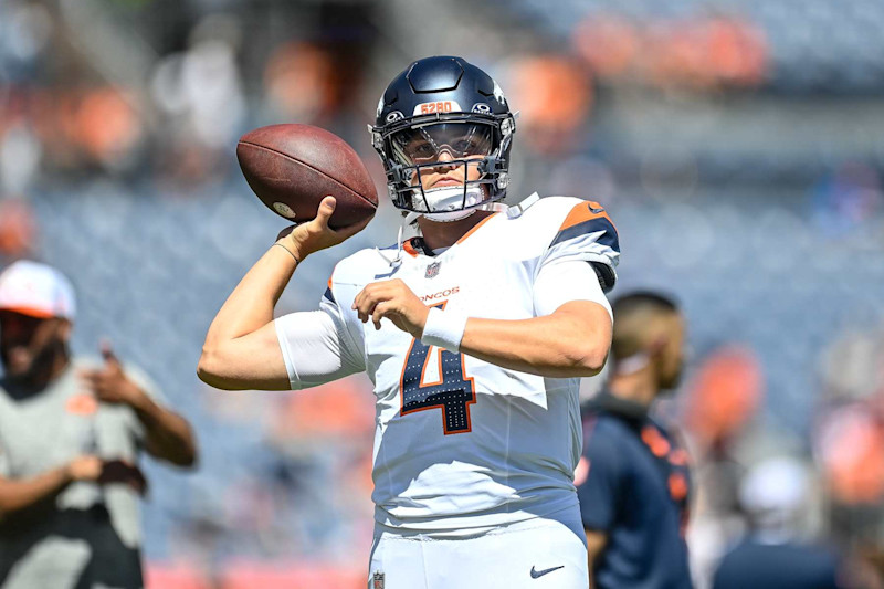 DENVER, COLORADO - AUGUST 25:  Zach Wilson #4 of the Denver Broncos warms up before the preseason game against the Arizona Cardinals at Empower Field at Mile High on August 25, 2024 in Denver, Colorado. (Photo by Dustin Bradford/Getty Images)