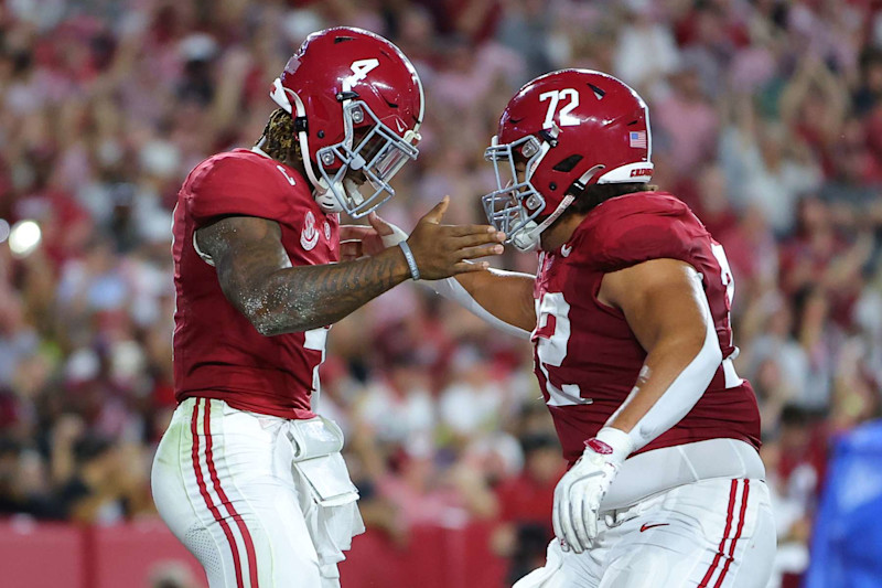 TUSCALOOSA, ALABAMA - SEPTEMBER 28: Jalen Milroe #4 of the Alabama Crimson Tide celebrates after scoring a rushing touchdown against the Georgia Bulldogs with Parker Brailsford #72 during the first quarter at Bryant-Denny Stadium on September 28, 2024 in Tuscaloosa, Alabama. (Photo by Kevin C. Cox/Getty Images)