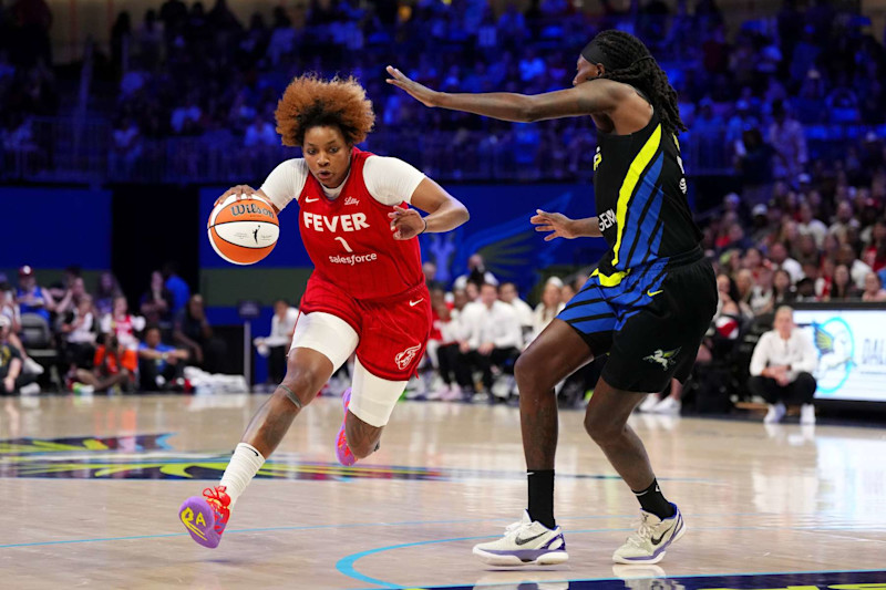 ARLINGTON, TEXAS - SEPTEMBER 01: NaLyssa Smith #1 of the Indiana Fever drives against Natasha Howard #6 of the Dallas Wings in the second half at College Park Center on September 01, 2024 in Arlington, Texas. NOTE TO USER: User expressly acknowledges and agrees that, by downloading and or using this photograph, User is consenting to the terms and conditions of the Getty Images License Agreement. (Photo by Sam Hodde/Getty Images)