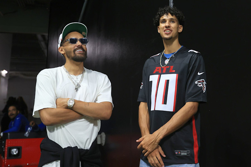 ATLANTA, GA - SEPTEMBER 22: Trae Young (l) and Zaccharie Risacher of the Atlanta Hawks were on hand for the Sunday evening NFL game between the Atlanta Falcons and the Kansas City Chiefs on September 22, 2024 at the Mercedes-Benz Stadium in Atlanta, Georgia.   (Photo by David J. Griffin/Icon Sportswire via Getty Images)