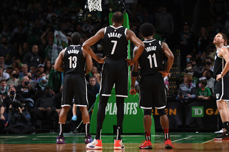 BOSTON, MA - MAY 30: James Harden #13, Kevin Durant #7, and Kyrie Irving #11 of the Brooklyn Nets look on during Round 1, Game 4 of the 2021 NBA Playoffs on May 30, 2021 at the TD Garden in Boston, Massachusetts. NOTE TO USER: User expressly acknowledges and agrees that, by downloading and or using this photograph, User is consenting to the terms and conditions of the Getty Images License Agreement. Mandatory Copyright Notice: Copyright 2021 NBAE (Photo by Brian Babineau/NBAE via Getty Images)