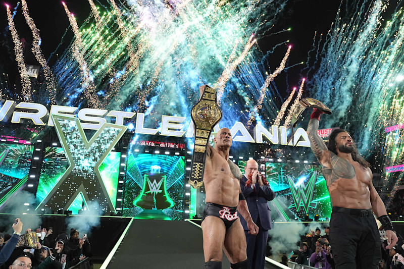 PHILADELPHIA, PENNSYLVANIA - APRIL 6: (L-R) The Rock, Paul Heyman and Roman Reigns celebrate their victory at WrestleMania 40 at Lincoln Financial Field on April 6, 2024 in Philadelphia, Pennsylvania. (Photo by WWE/Getty Images)