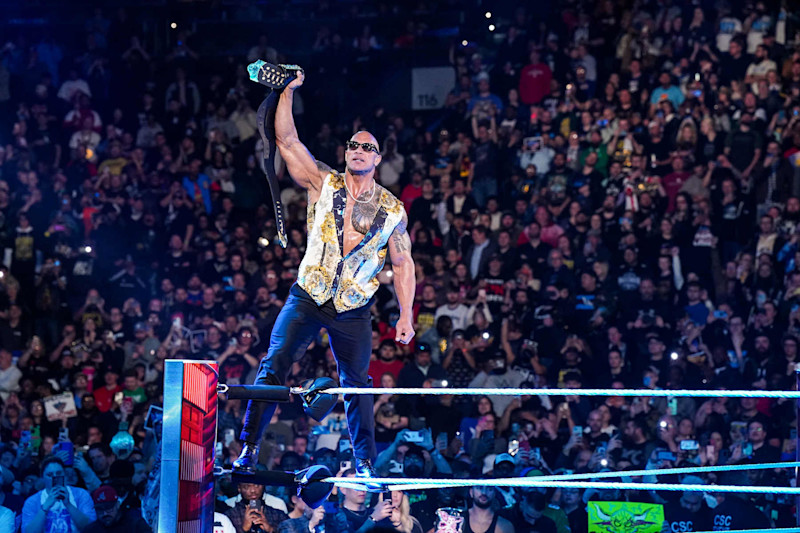 PHILADELPHIA, PENNSYLVANIA - APRIL 08: Dwayne "The Rock" Johnson stands in ring at the Wells Fargo Center on April 8, 2024 in Philadelphia, Pennsylvania. (Photo by WWE/Getty Images)