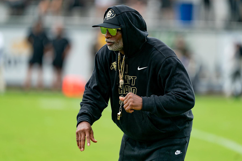 ORLANDO, FL - SEPTEMBER 28:  Colorado Buffaloes head coach Deion Sanders dances during warm ups before a college football game between the Colorado Buffaloes and the UCF Knights on September 28th, 2024 at FBC Mortgage Stadium in Orlando, FL. (Photo by Chris Leduc/Icon Sportswire via Getty Images)