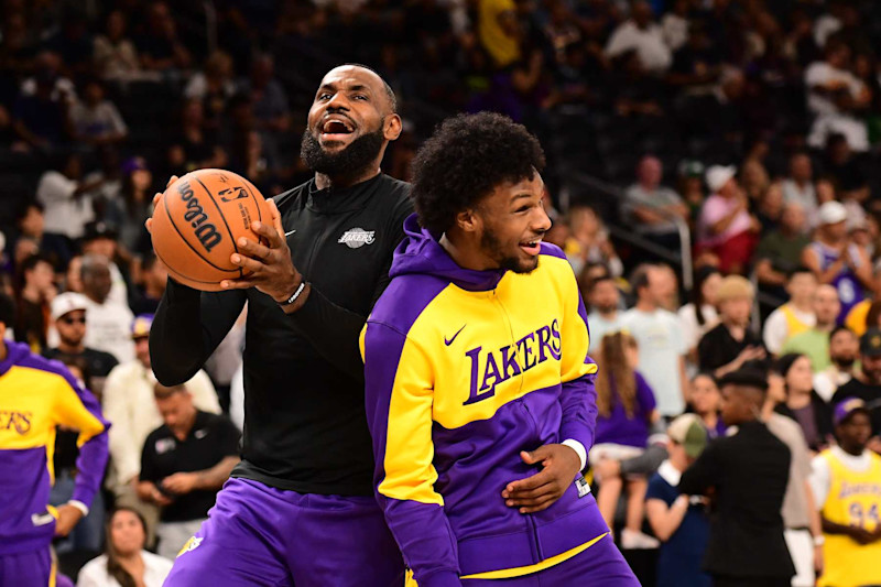 LOS ANGELES, CA - OCTOBER 6: LeBron James #23 and Bronny James #9 of the Los Angeles Lakers smile before the game against the Phoenix Suns on October 6, 2024 at Acrisure Arena in Palm Springs, California. NOTE TO USER: User expressly acknowledges and agrees that, by downloading and/or using this Photograph, user is consenting to the terms and conditions of the Getty Images License Agreement. Mandatory Copyright Notice: Copyright 2024 NBAE (Photo by Adam Pantozzi/NBAE via Getty Images)