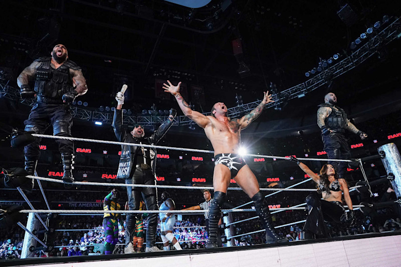 SUNRISE, FLORIDA - AUGUST 19: Akam, Paul Ellering, Karrion Kross, Scarlett, and Rezar of The Final Testament enter the ring during Monday Night RAW at Amerant Bank Arena on August 19, 2024 in Sunrise, Florida.  (Photo by WWE/Getty Images)