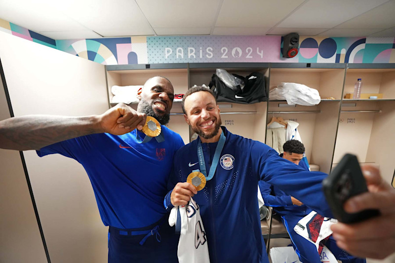 PARIS, FRANCE - AUGUST 10: LeBron James #6 and Stephen Curry #4 of Team USA pose for the camera after the Men's Gold Medal Game on August 10, 2024 at the AccorHotels Arena in Paris, France. NOTE TO USER: User expressly acknowledges and agrees that, by downloading and/or using this photograph, user is consenting to the terms and conditions of the Getty Images License Agreement. Mandatory Copyright Notice: Copyright 2024 NBAE (Photo by Jesse D. Garrabrant/NBAE via Getty Images)