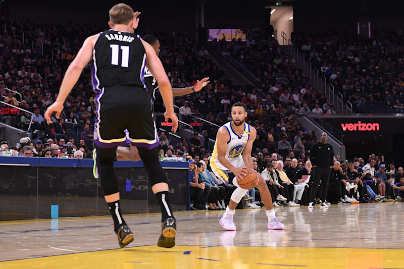 Domantas Sabonis and Stephen Curry