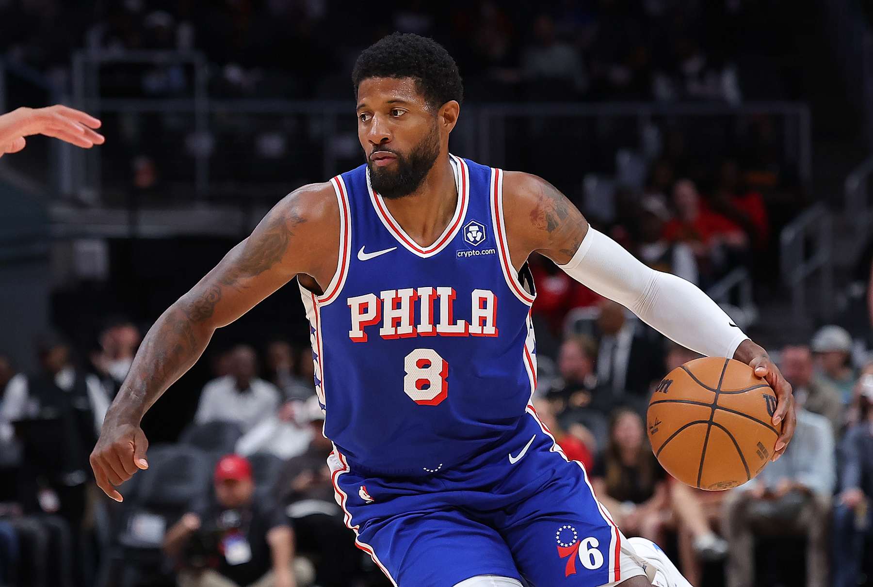 ATLANTA, GEORGIA - OCTOBER 14:  Paul George #8 of the Philadelphia 76ers drives against the Atlanta Hawks during the first quarter at State Farm Arena on October 14, 2024 in Atlanta, Georgia.  NOTE TO USER: User expressly acknowledges and agrees that, by downloading and/or using this photograph, user is consenting to the terms and conditions of the Getty Images License Agreement.  (Photo by Kevin C. Cox/Getty Images)