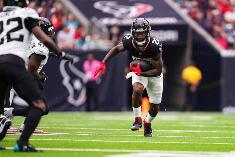 HOUSTON, TX - SEPTEMBER 29: Cam Akers #22 of the Houston Texans runs the ball during an NFL football game against the Jacksonville Jaguars at NRG Stadium on September 29, 2024 in Houston, Texas. (Photo by Cooper Neill/Getty Images)