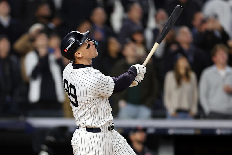 NEW YORK, NEW YORK - OCTOBER 15: Aaron Judge #99 of the New York Yankees watches as Brayan Rocchio #4 of the Cleveland Guardians makes a fielding error on his hit in the first inning during Game Two of the American League Championship Series at Yankee Stadium on October 15, 2024 in New York City. (Photo by Elsa/Getty Images)