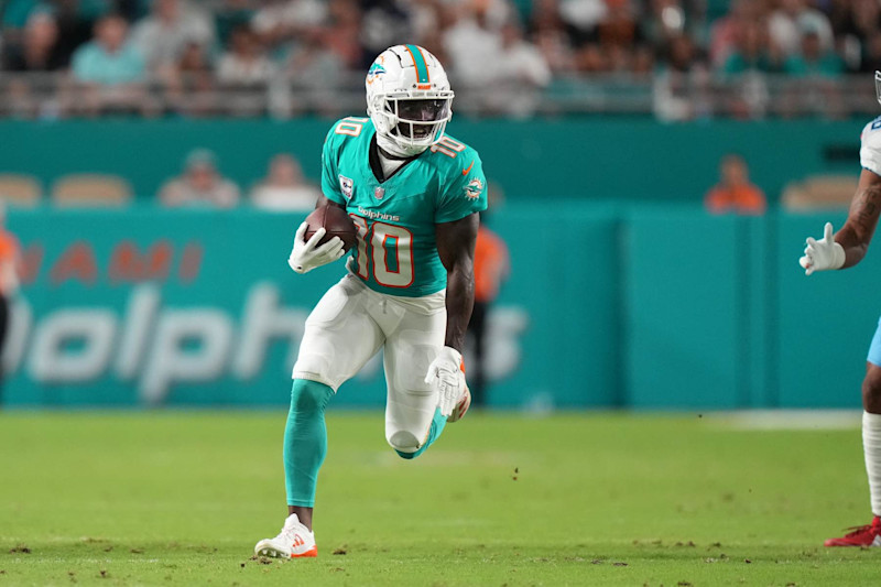 MIAMI GARDENS, FL - SEPTEMBER 30: Miami Dolphins wide receiver Tyreek Hill (10) rushes with the ball during the game between the Tennessee Titans and the Miami Dolphins on Monday, September 30, 2024 at Hard Rock Stadium in Miami Gardens, Fla. (Photo by Peter Joneleit/Icon Sportswire via Getty Images)