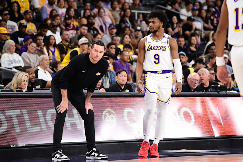 LOS ANGELES, CA - OCTOBER 6: Head Coach JJ Redick and Bronny James #9 of the Los Angeles Lakers looks on during the game against the Phoenix Suns on October 6, 2024 at Acrisure Arena in Palm Springs, California. NOTE TO USER: User expressly acknowledges and agrees that, by downloading and/or using this Photograph, user is consenting to the terms and conditions of the Getty Images License Agreement. Mandatory Copyright Notice: Copyright 2024 NBAE (Photo by Adam Pantozzi/NBAE via Getty Images)