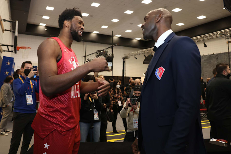 CLEVELAND, OH - FEBRUARY 20: Joel Embiid #21 of the Philadelphia 76ers talks to NBA Legend, Kevin Garnett during the NBA 75 Group Photo as part of the 2022 NBA All Star Weekend on February 20, 2022 at Rocket Mortgage FieldHouse in Cleveland, Ohio. NOTE TO USER: User expressly acknowledges and agrees that, by downloading and/or using this Photograph, user is consenting to the terms and conditions of the Getty Images License Agreement. Mandatory Copyright Notice: Copyright 2022 NBAE (Photo by Michael J. LeBrecht II/NBAE via Getty Images)