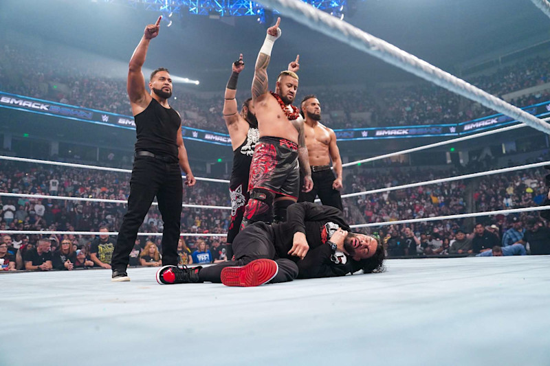 COLUMBIA, SOUTH CAROLINA - OCTOBER 18: Solo Siko, Jacob Fatu, Tonga Loa and Tama Tonga stand over Roman Reigns during SmackDown at Colonial Life Arena on October 18, 2024 in Columbia, South Carolina. (Photo by WWE/Getty Images)