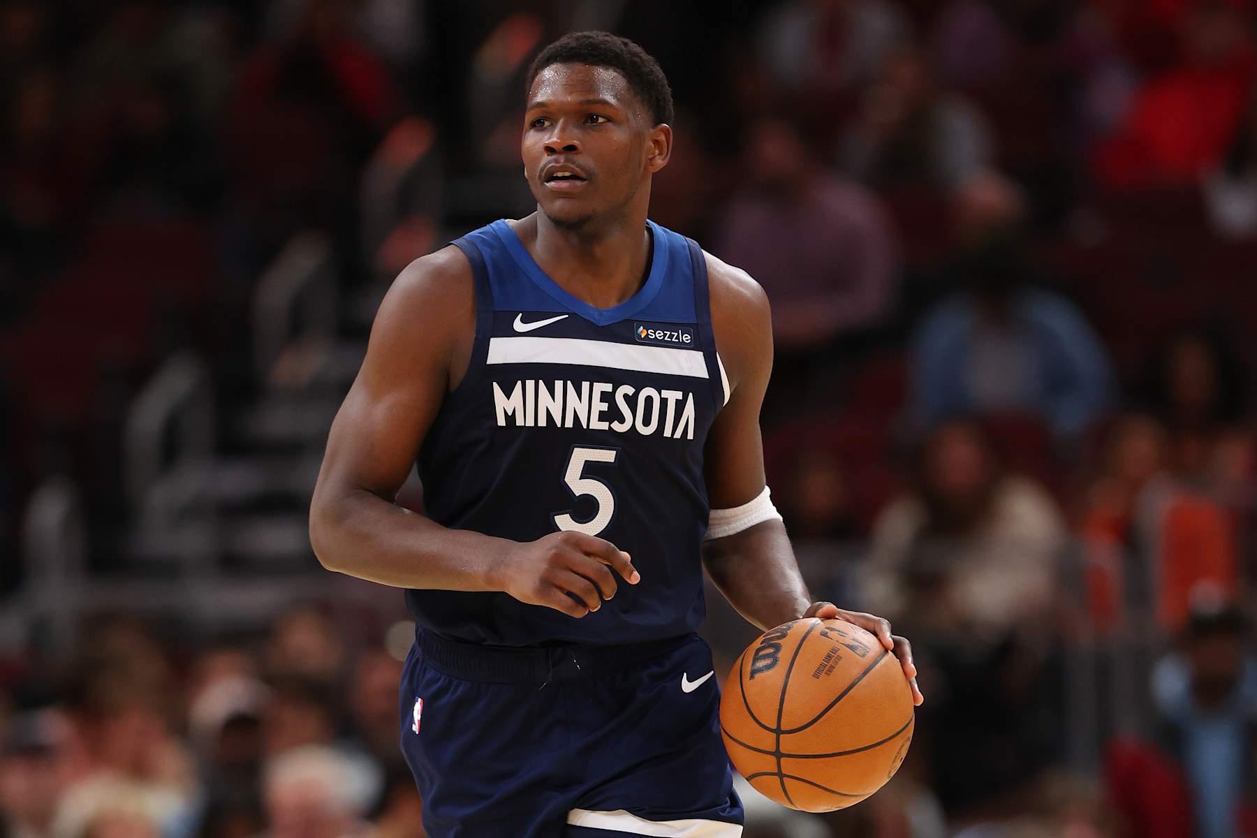 CHICAGO, ILLINOIS - OCTOBER 16: Anthony Edwards #5 of the Minnesota Timberwolves dribbles up the court against the Chicago Bulls during the second half of a preseason game at the United Center on October 16, 2024 in Chicago, Illinois. NOTE TO USER: User expressly acknowledges and agrees that, by downloading and or using this photograph, User is consenting to the terms and conditions of the Getty Images License Agreement.  (Photo by Michael Reaves/Getty Images)