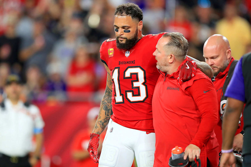 TAMPA, FL - OCTOBER 21: Tampa Bay Buccaneers wide receiver Mike Evans (13) is helped off the field during the game between the Baltimore Ravens and the Tampa Bay Buccaneers on October 21, 2024 at Raymond James Stadium in Tampa, Florida. (Photo by Cliff Welch/Icon Sportswire via Getty Images)