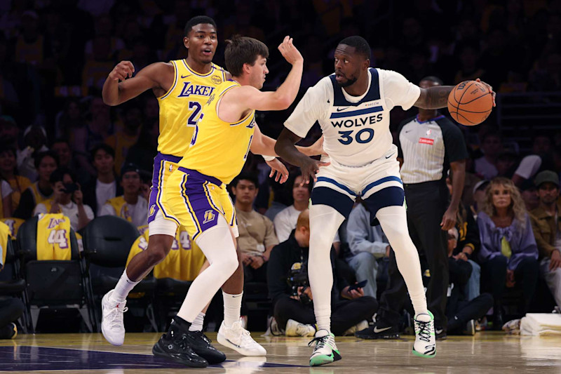 LOS ANGELES, CALIFORNIA - OCTOBER 22: Julius Randle #30 of the Minnesota Timberwolves makes a move on Austin Reaves #15 and Rui Hachimura #28 of the Los Angeles Lakers during the first quarter at Crypto.com Arena on October 22, 2024 in Los Angeles, California. (Photo by Harry How/Getty Images)