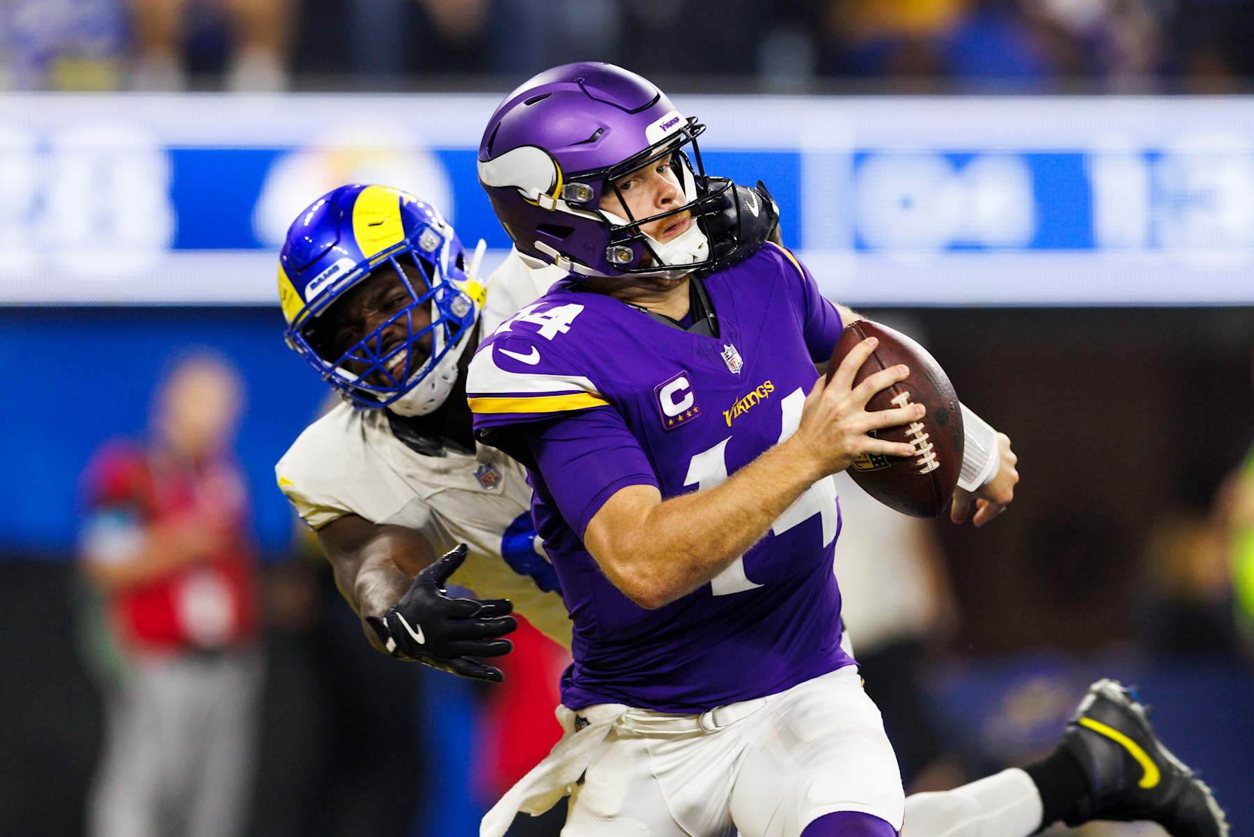 INGLEWOOD, CALIFORNIA - OCTOBER 24: Jared Verse (L) #8 of the Los Angeles Rams sacks Sam Darnold #14 of the Minnesota Vikings for a safety during the second half at SoFi Stadium on October 24, 2024 in Inglewood, California. (Photo by Ric Tapia/Getty Images)