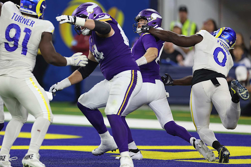 INGLEWOOD, CALIFORNIA - OCTOBER 24: Byron Young #0 of the Los Angeles Rams makes the tackle against Sam Darnold #14 of the Minnesota Vikings for a safety in the fourth quarter at SoFi Stadium on October 24, 2024 in Inglewood, California. (Photo by Harry How/Getty Images)