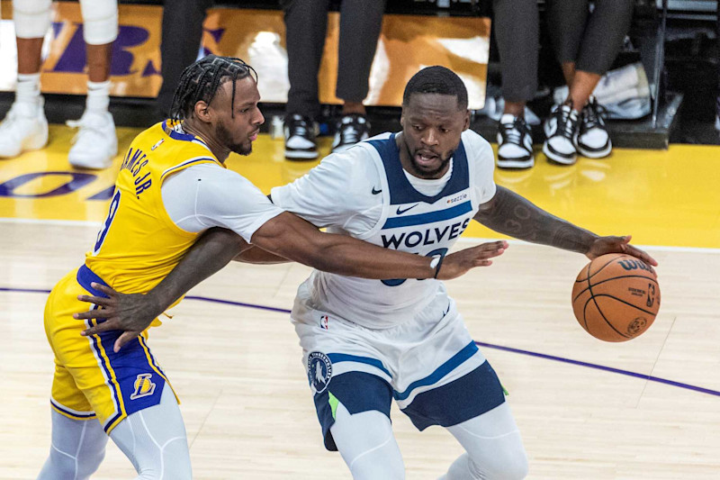 Los Angeles Lakers' Bronny James L defends Minnesota Timberwolves' Julius Randle during the 2024-2025 NBA regular season match between Los Angeles Lakers and Minnesota Timberwolves in Los Angeles, the United States, Oct. 22, 2024. (Photo by Ringo Chiu/Xinhua via Getty Images)