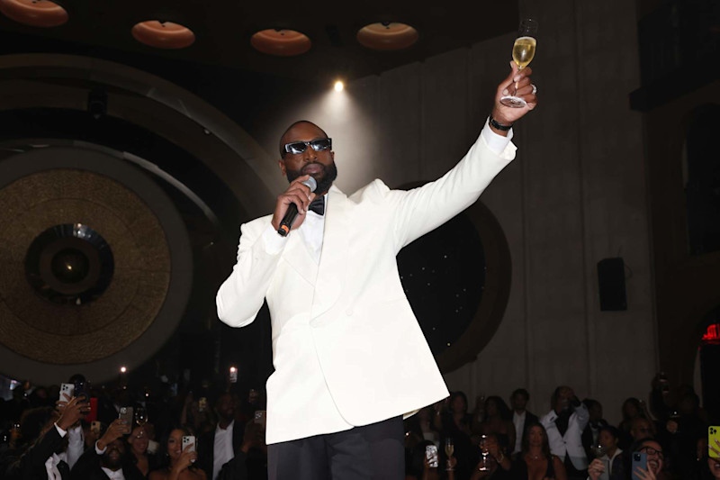 MIAMI BEACH, FLORIDA - OCTOBER 25: Dwyane Wade speaks on stage at his 003 Statues Are Forever Party With FWRD at Queen Miami Beach on October 25, 2024 in Miami Beach, Florida. (Photo by Alexander Tamargo/Getty Images for FWRD)