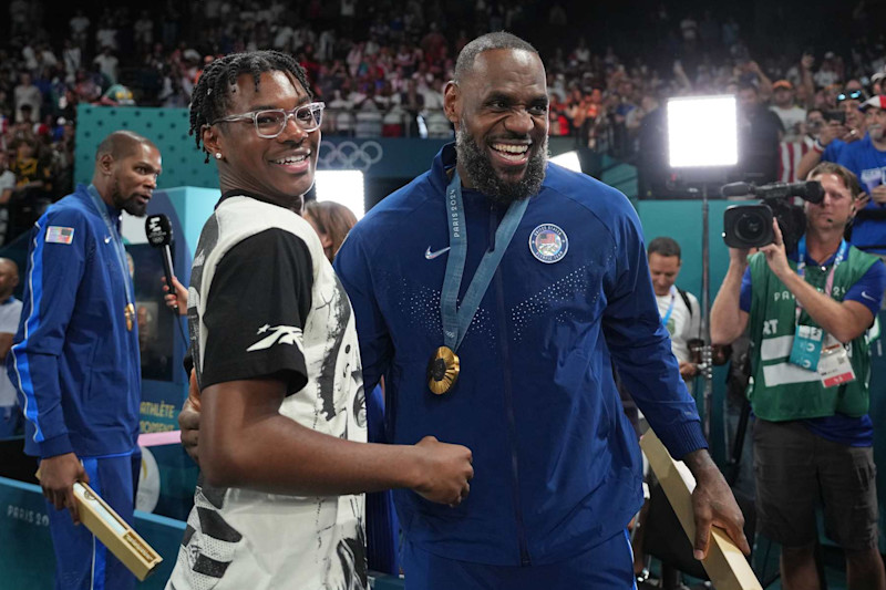 PARIS, FRANCE - AUGUST 10: Bryce James and his father LeBron James celebrates after the Men's Gold Medal Game on August 10, 2024 at the AccorHotels Arena in Paris, France. NOTE TO USER: User expressly acknowledges and agrees that, by downloading and/or using this photograph, user is consenting to the terms and conditions of the Getty Images License Agreement. Mandatory Copyright Notice: Copyright 2024 NBAE (Photo by Jesse D. Garrabrant/NBAE via Getty Images)