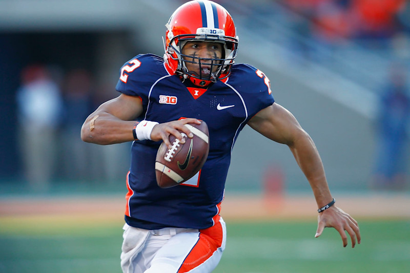 CHAMPAIGN, IL - NOVEMBER 30: Quarterback Nathan Scheelhaase #2 of the Illinois Fighting Illini runs the ball against the Illinois Fighting Illini at Memorial Stadium on November 30, 2013 in Champaign, Illinois. Northwestern defeated Illinois 37-34. (Photo by Michael Hickey/Getty Images)