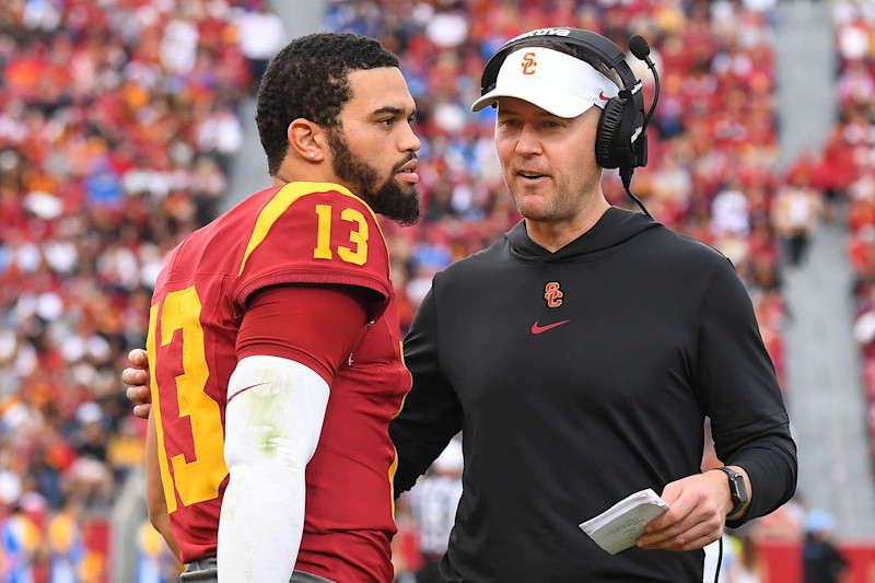 LOS ANGELES, CA - NOVEMBER 18: USC Trojans quarterback Caleb Williams (13) talks with USC Trojans head coach Lincoln Riley during a college football game between the UCLA Bruins and the USC Trojans on November 18, 2023, at Los Angeles Memorial Coliseum in Los Angeles, CA. (Photo by Brian Rothmuller/Icon Sportswire via Getty Images)